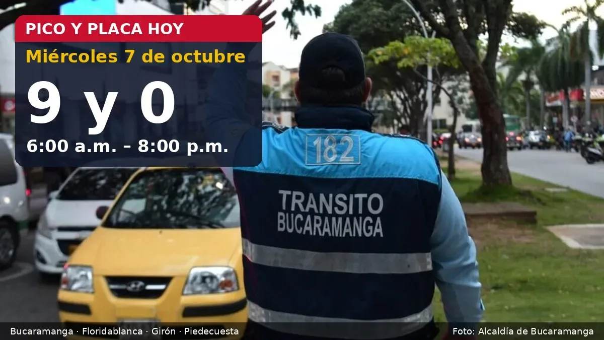 Agente de la Dirección de Tránsito de Bucaramanga regula el tráfico junto a un taxi, con el aviso de pico y placa para placas 9 y 0